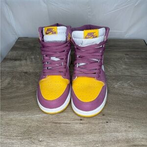 Jordan Ones University gold and purple.